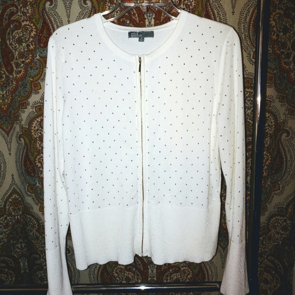 White cardigan with accent.